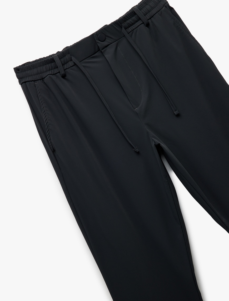   Katlamalı Paça Beli Bağcıklı Düğmeli Esnek Slim Fit Pantolon