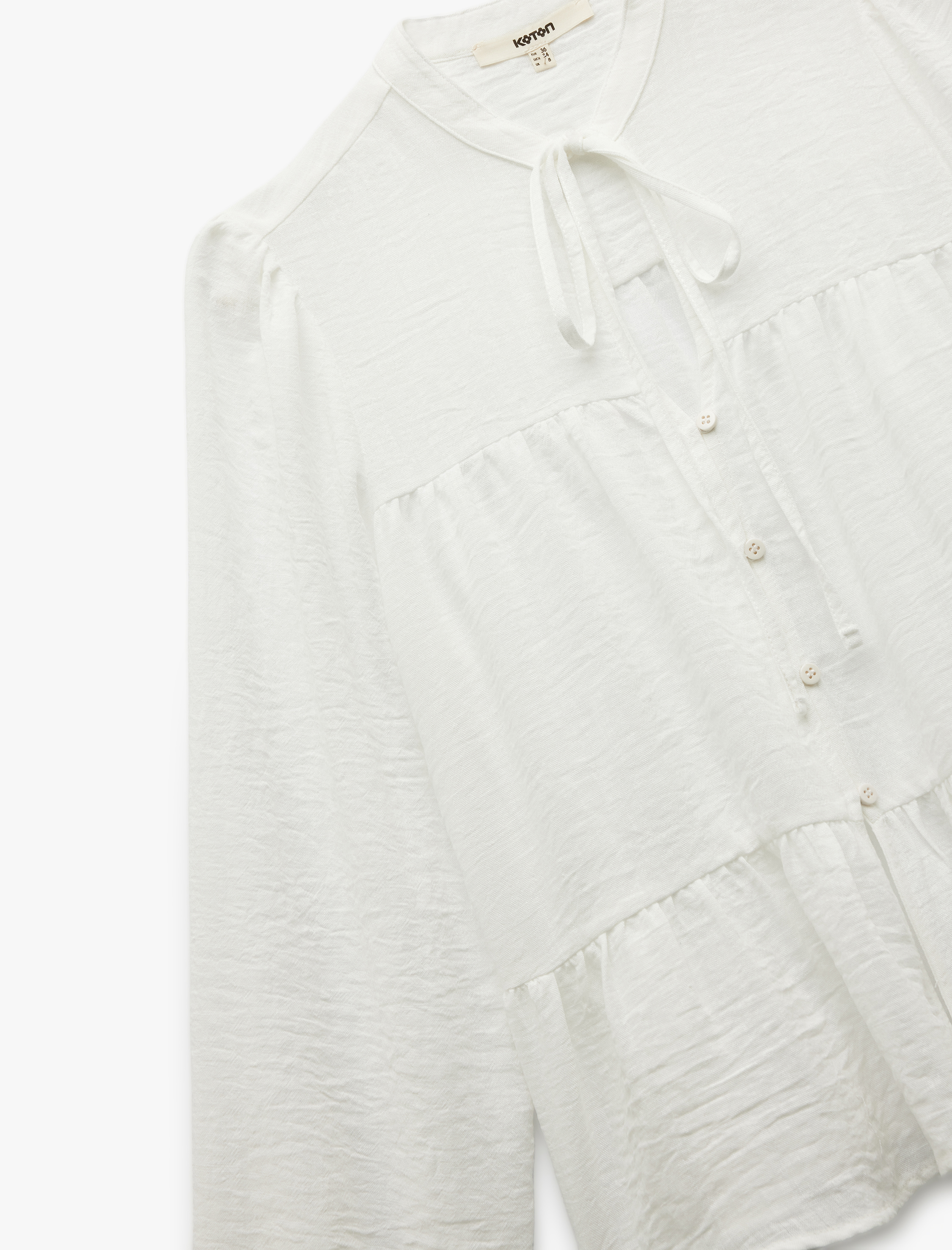   Keten Görünümlü Uzun Balon Kollu Fiyonklu Hakim Yaka Bağlama Detaylı Bluz