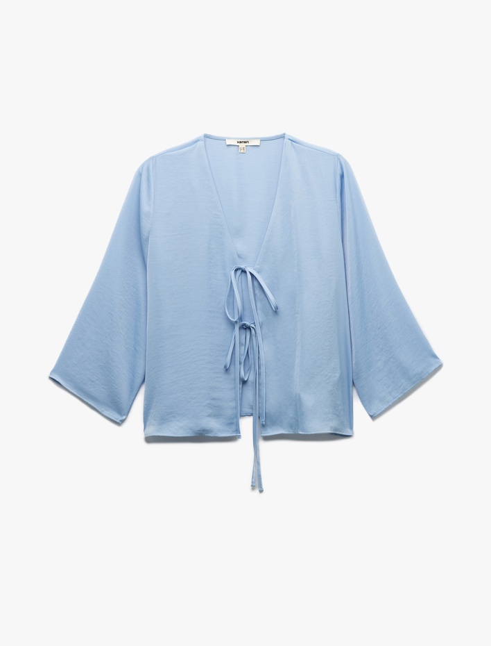  Aerobin Kumaş V Yaka Geniş Kol Fiyonklu Önden Bağlama Detaylı Bluz