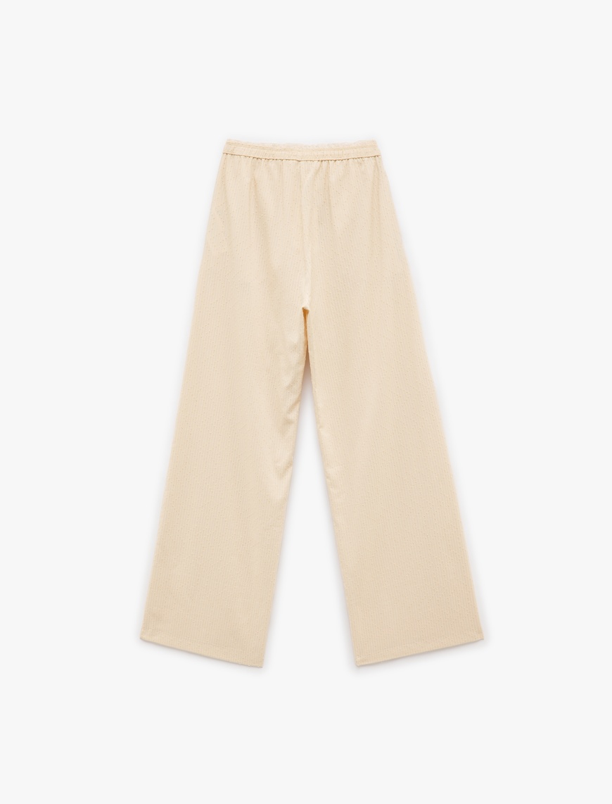   Beli Lastikli Dokulu Cepli Geniş Paça Pantolon