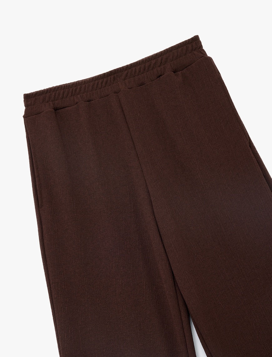   Beli Lastikli Regular Fit Cepli Eşofman Pantolon