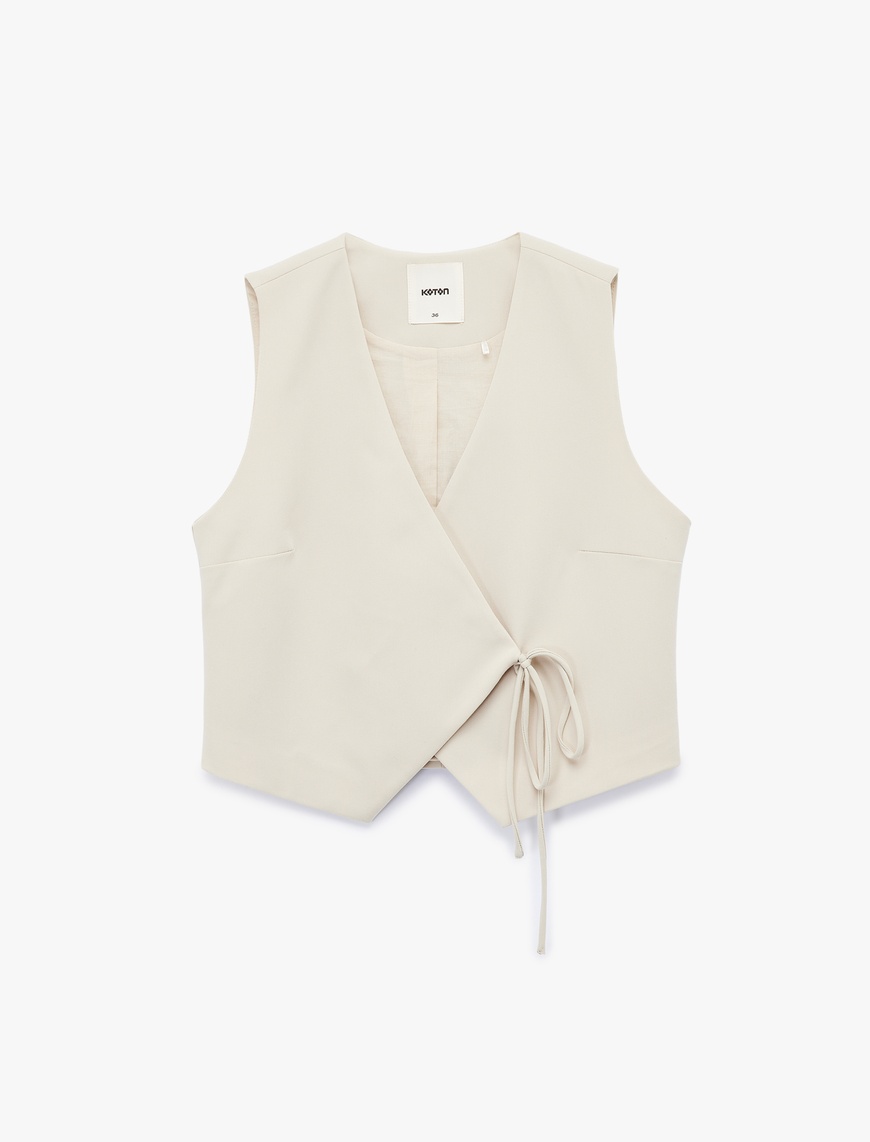   Viskon Karışımlı Slim Fit Bağlama Detaylı Crop Kruvaze Yaka Asimetrik Yelek