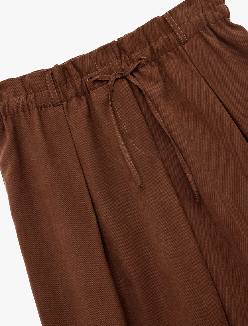   Rahat Kalıp Beli Lastikli Bağcıklı Pile Detaylı Bol Paça Pantolon