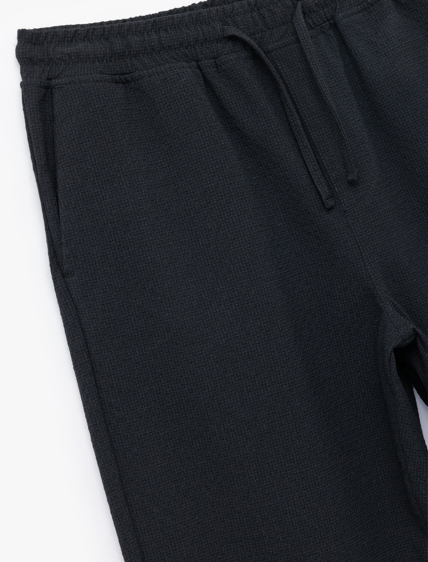   Viskon Karışımlı Cep Detaylı Dokulu Beli Bağcıklı Pantolon