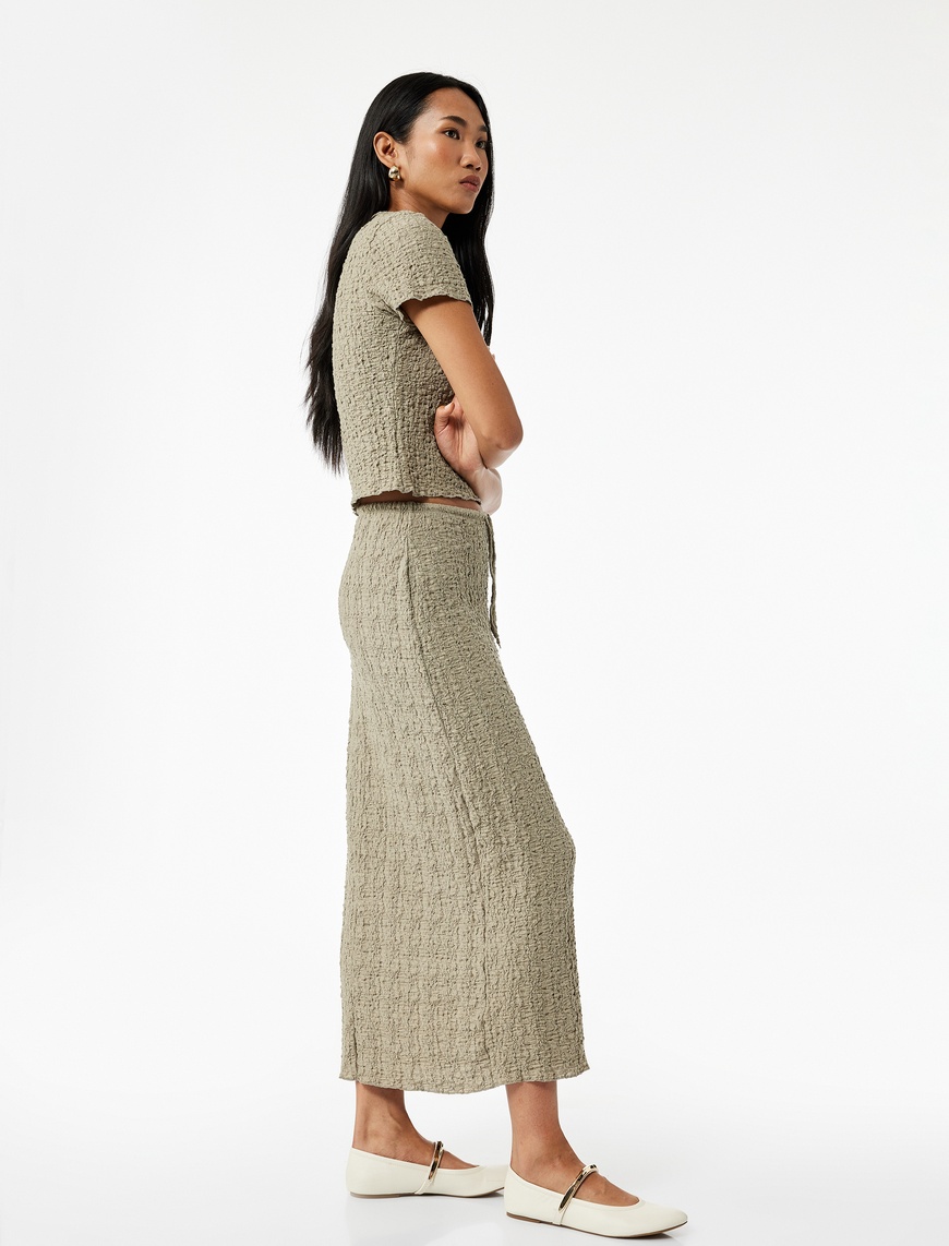   Beli Bağcıklı Slim Fit Bürümcük Kumaş Dokulu Midi Kalem Etek