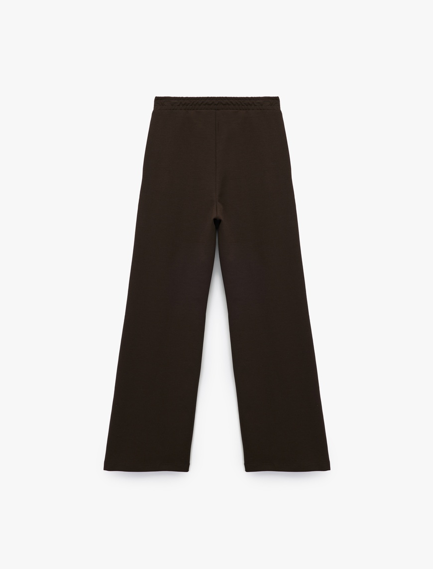   Beli Lastik Detaylı Cepli Geniş Paça Pantolon