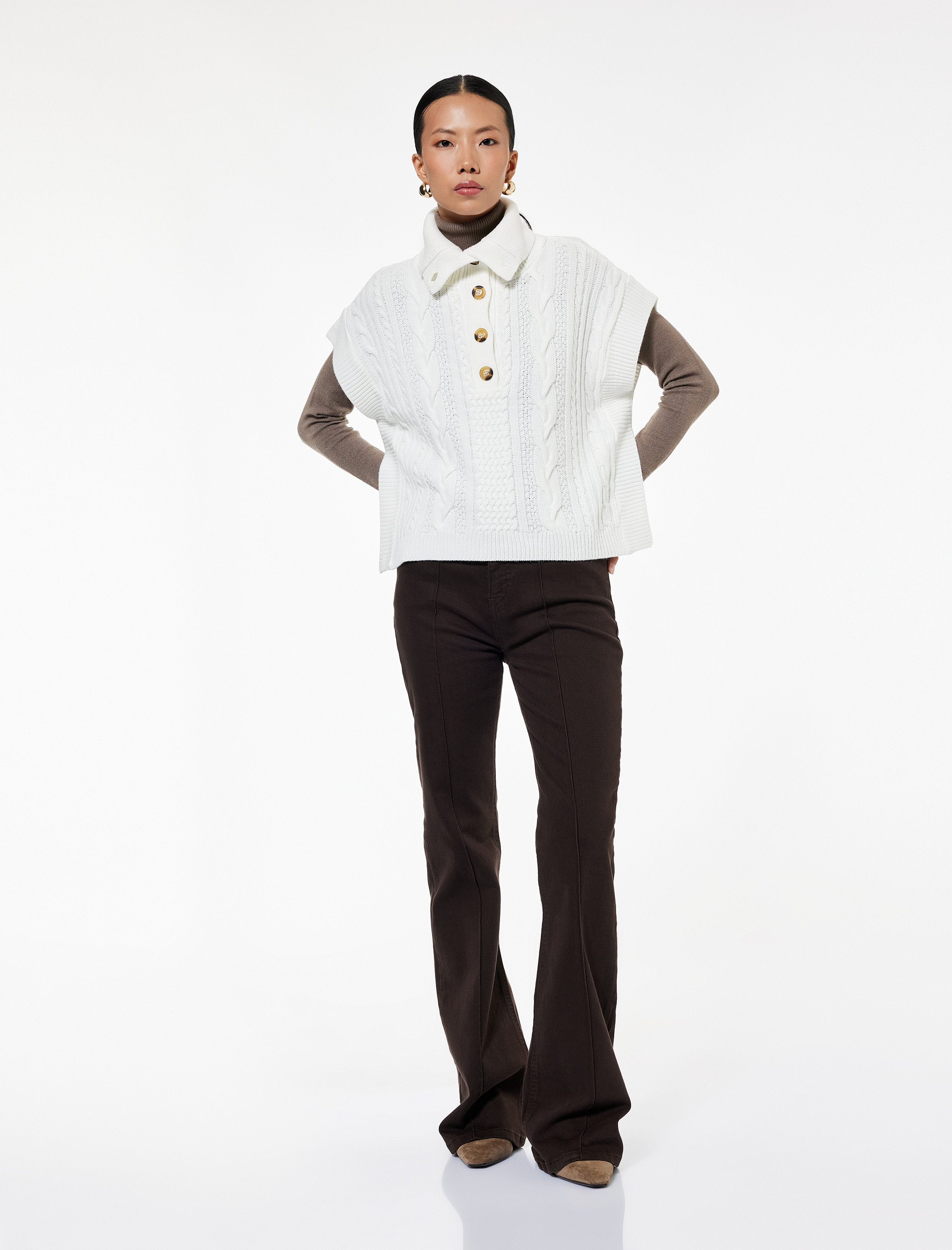   Yarım Düğmeli Devrik Yaka Kolsuz Saç Örgü Süveter