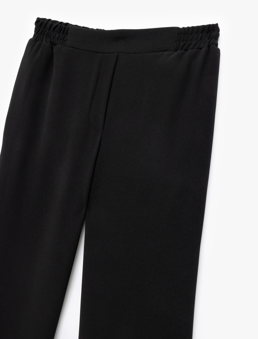   Krep Kumaş Beli Lastikli Düz Bol Paça Pantolon