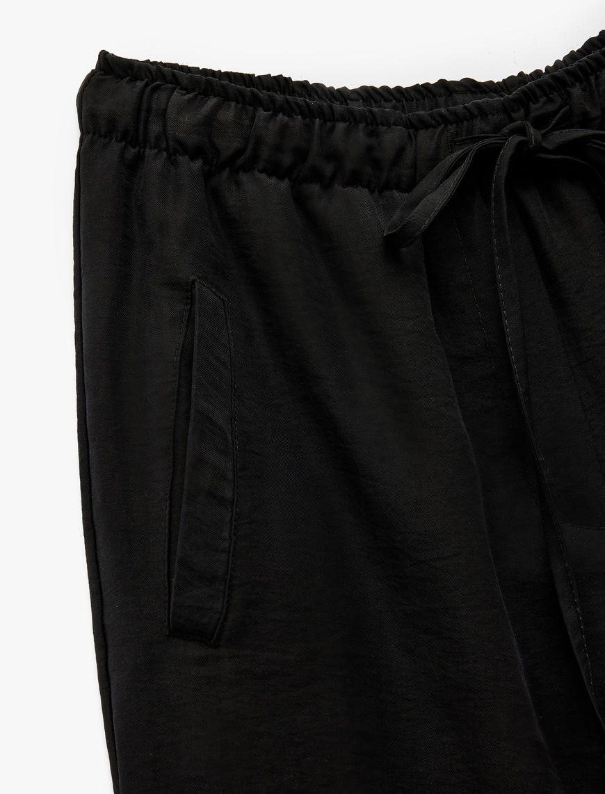   Beli Bağcıklı Bol Kalıp Cepli Geniş Paça Pantolon