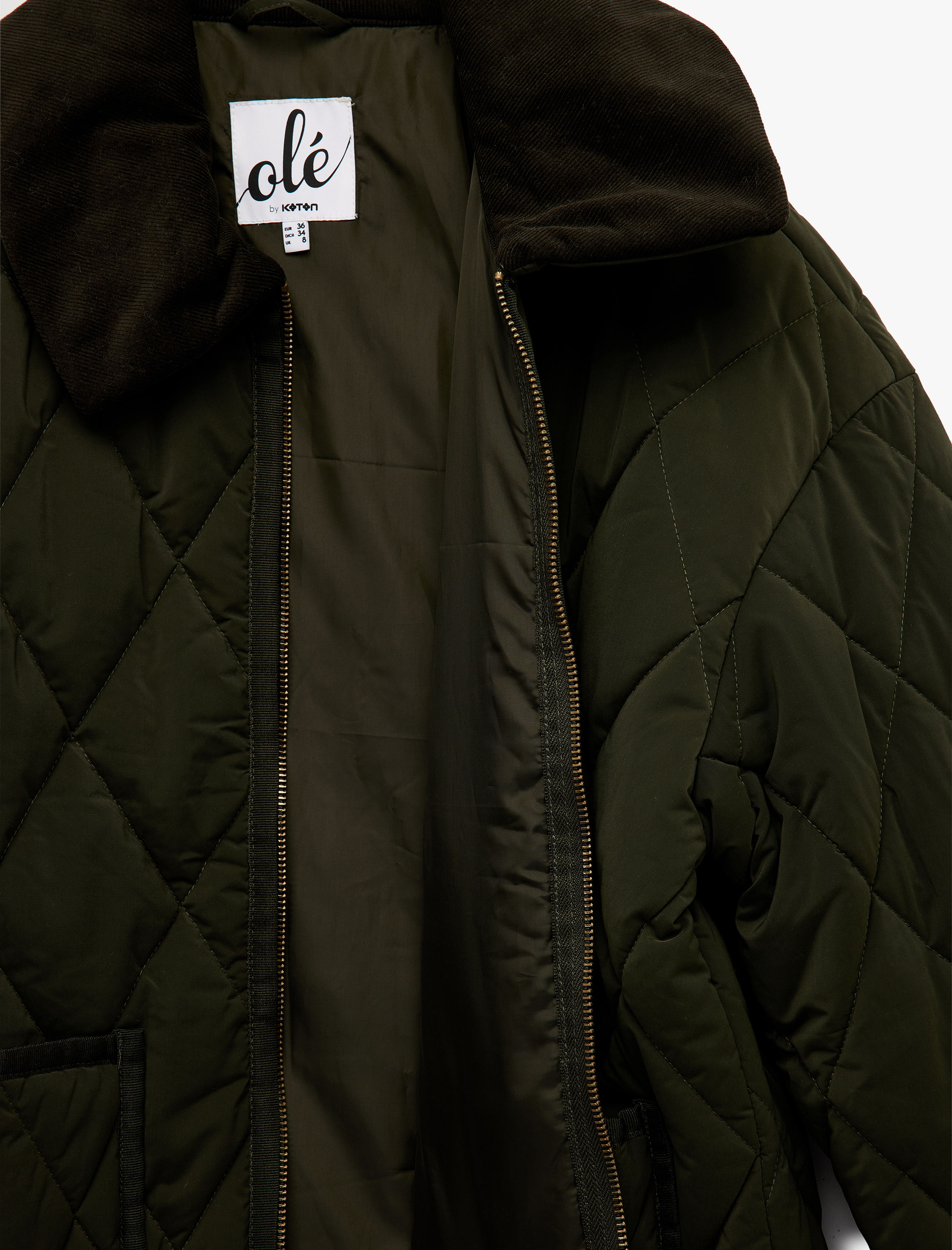   Uzun Kollu Fermuarlı Cep Detaylı Klasik Yaka Kapitone Ceket