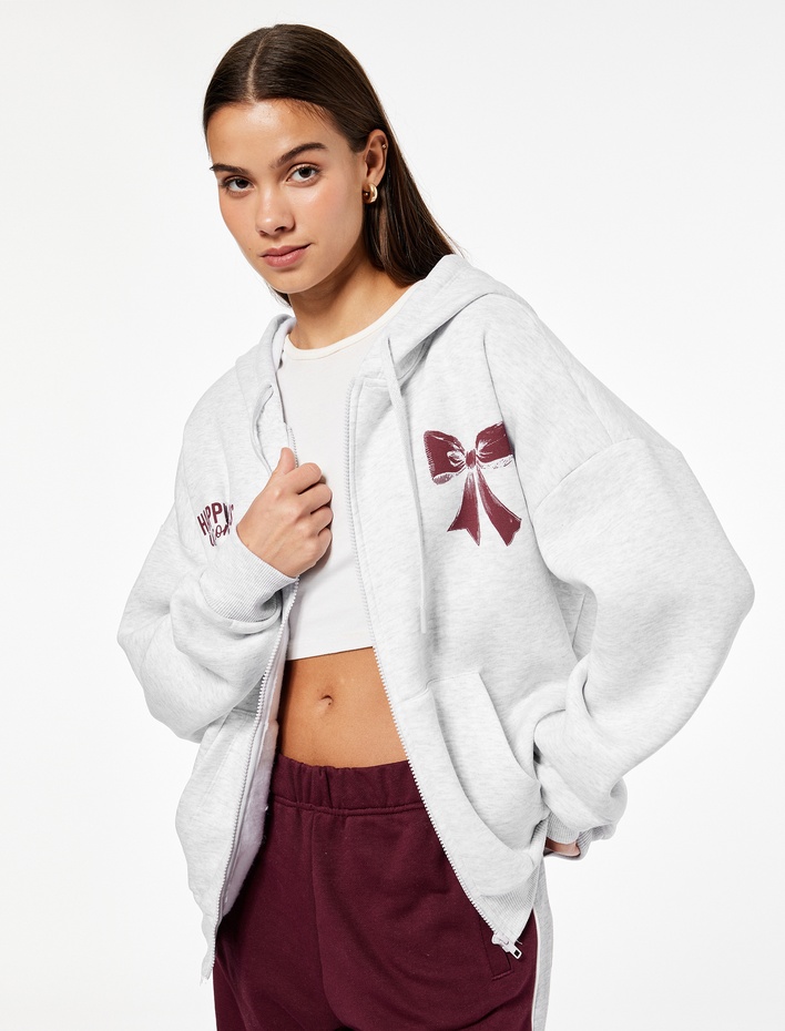  Fermuarlı Kapüşonlu Kanguru Cep Detaylı Arkası Fiyonk Baskılı Şardonlu Oversize Sweatshirt