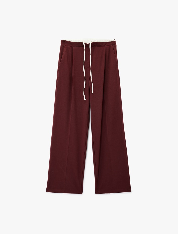  Cepli Pile Detaylı Beli Bağcıklı Geniş Paça Kumaş Pantolon