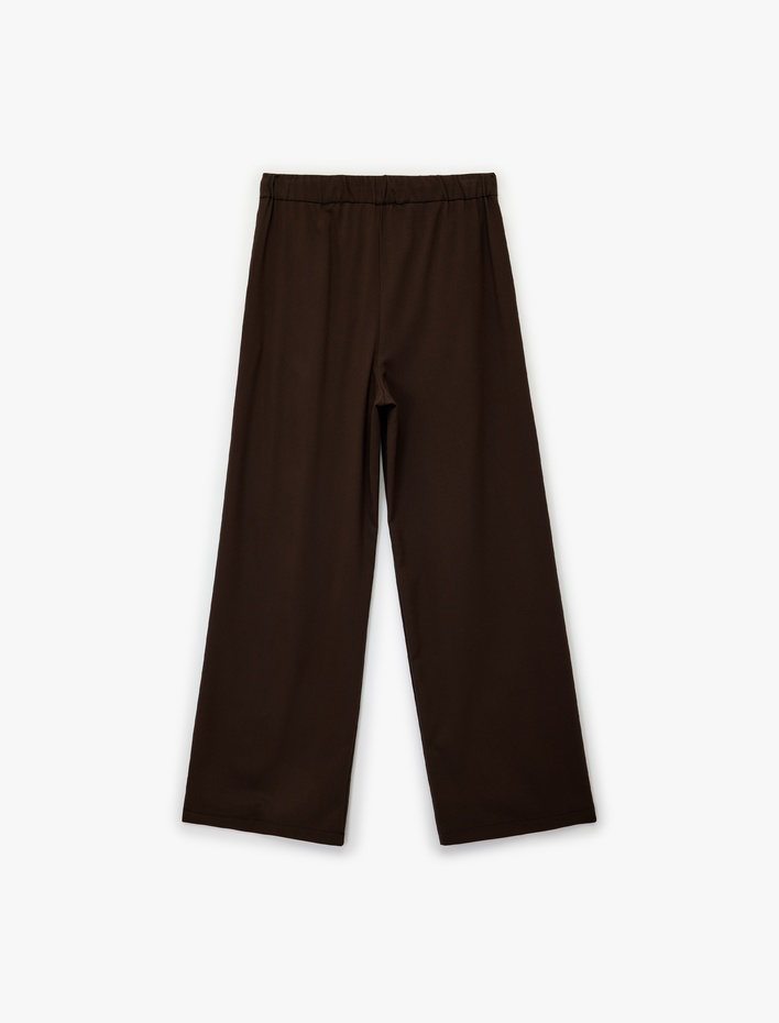  Viskon Karışımlı Cepli Düğmeli Beli Bağcıklı Geniş Paça Kumaş Pantolon