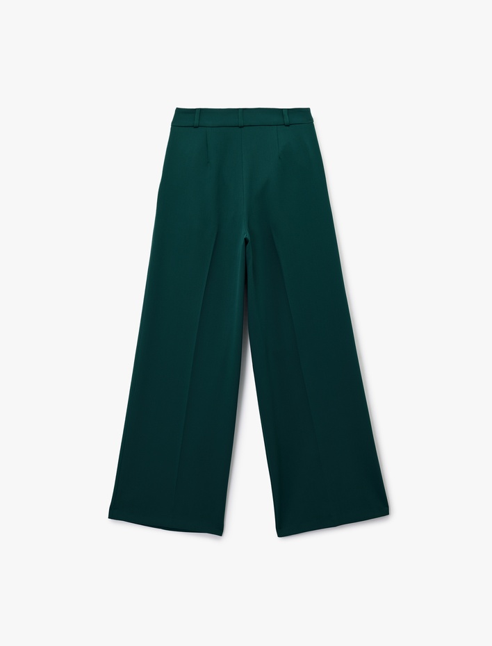  Asimetrik Kapama Detaylı Cepli Pile Detaylı Geniş Paça Kumaş Pantolon