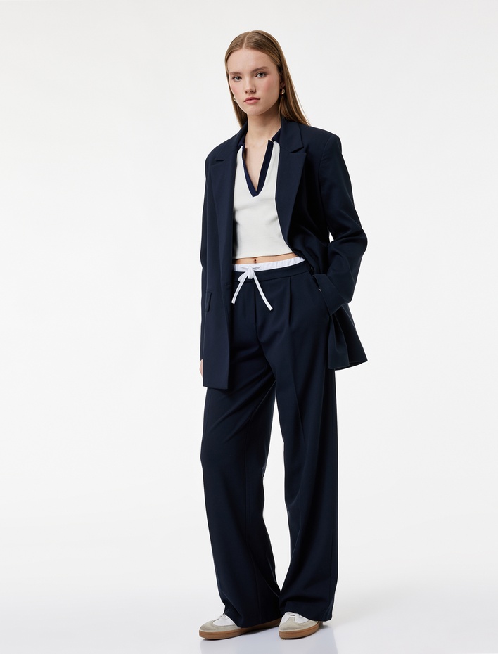  Cepli Pile Detaylı Beli Bağcıklı Geniş Paça Kumaş Pantolon