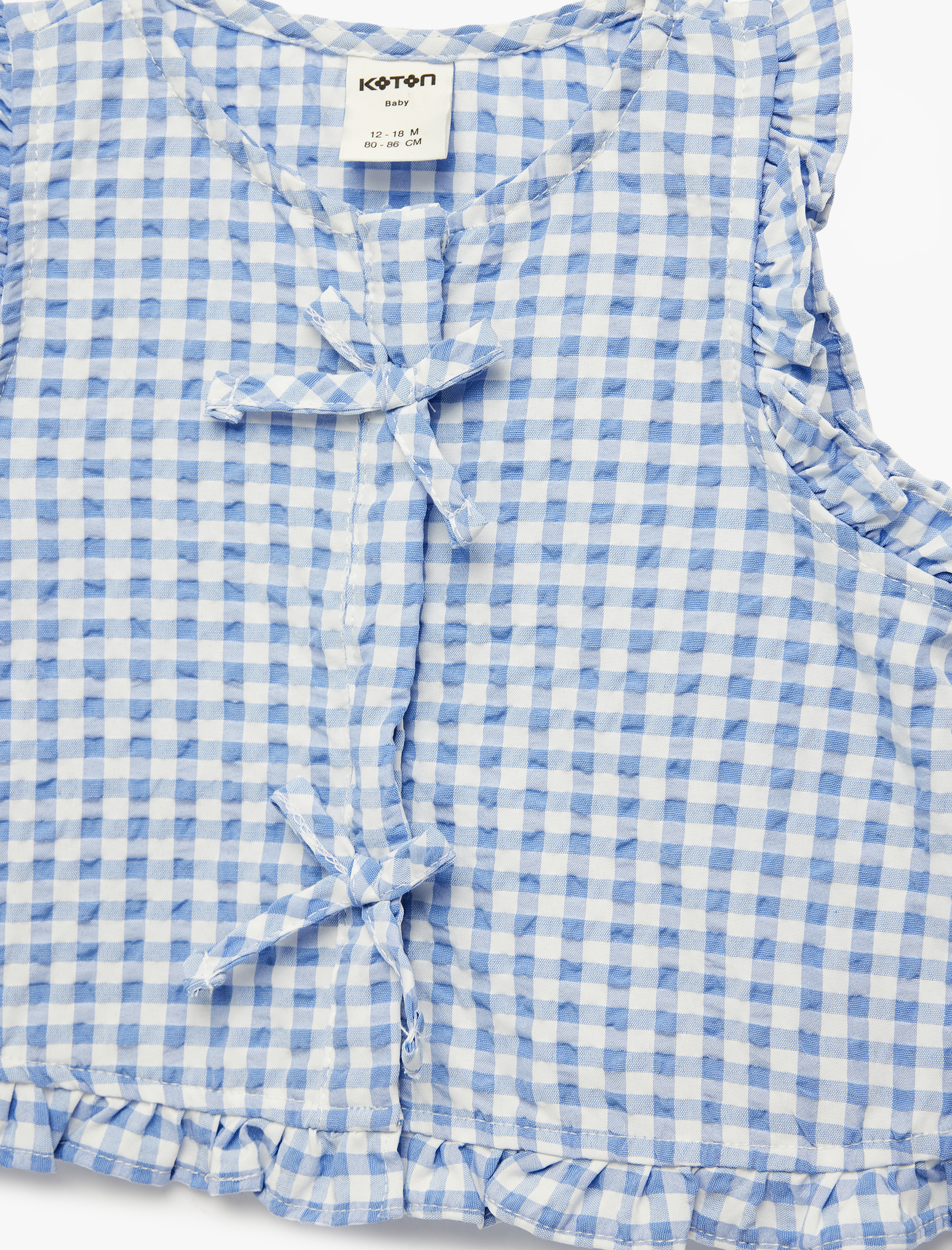  Kız Bebek Kolsuz Bisiklet Yaka Fırfır Detaylı Fiyonklu Pötikareli Gömlek