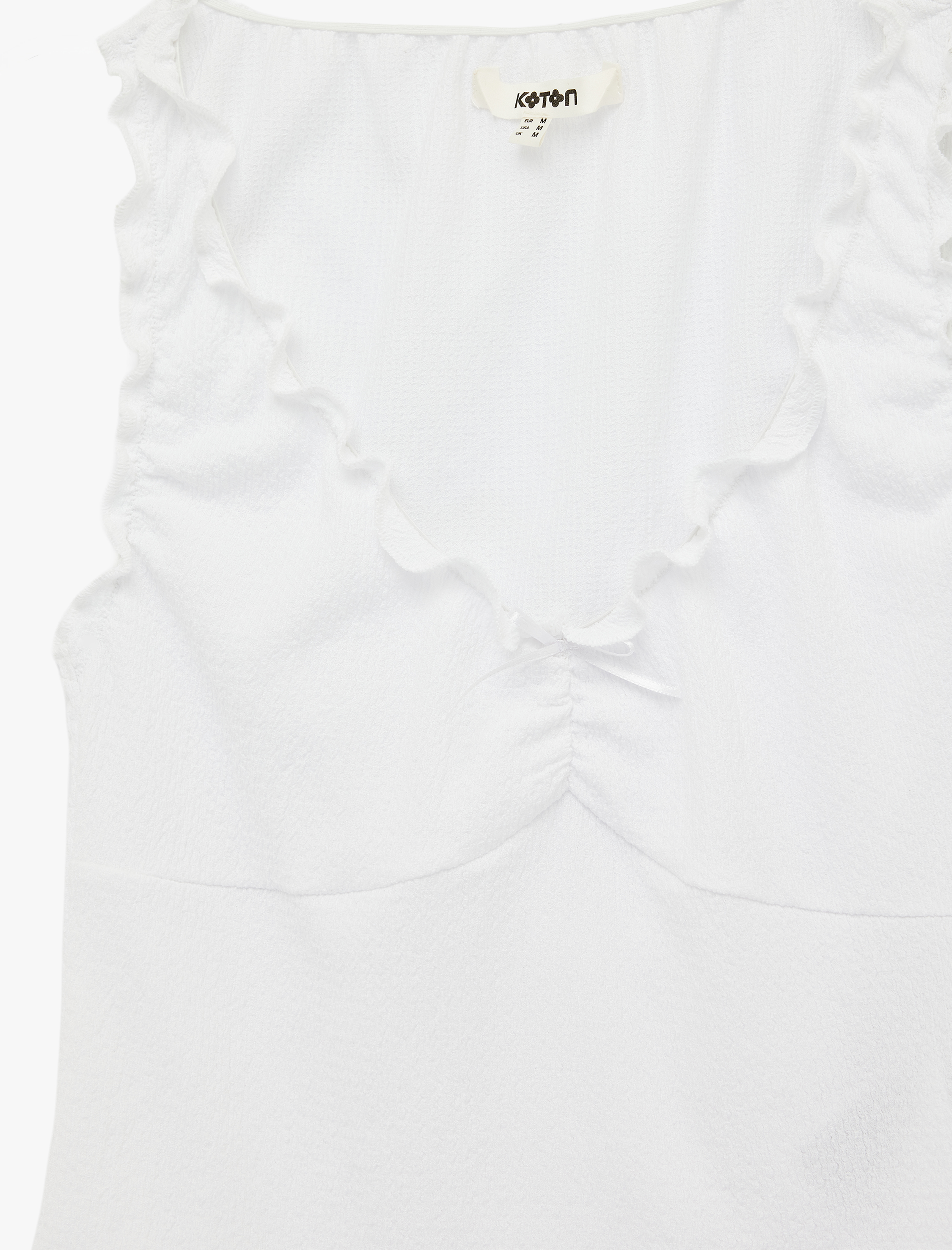   Bürümcük Kumaş V Yaka Fiyonklu Fırfırlı Kolsuz Bluz