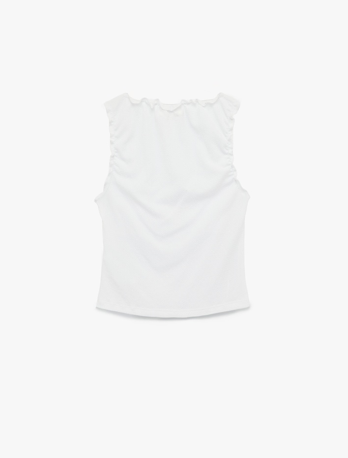  Bürümcük Kumaş V Yaka Fiyonklu Fırfırlı Kolsuz Bluz