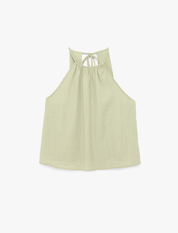  Viskon Karışımlı Kolsuz Bağlama Detaylı Dokulu Halter Yaka Bluz