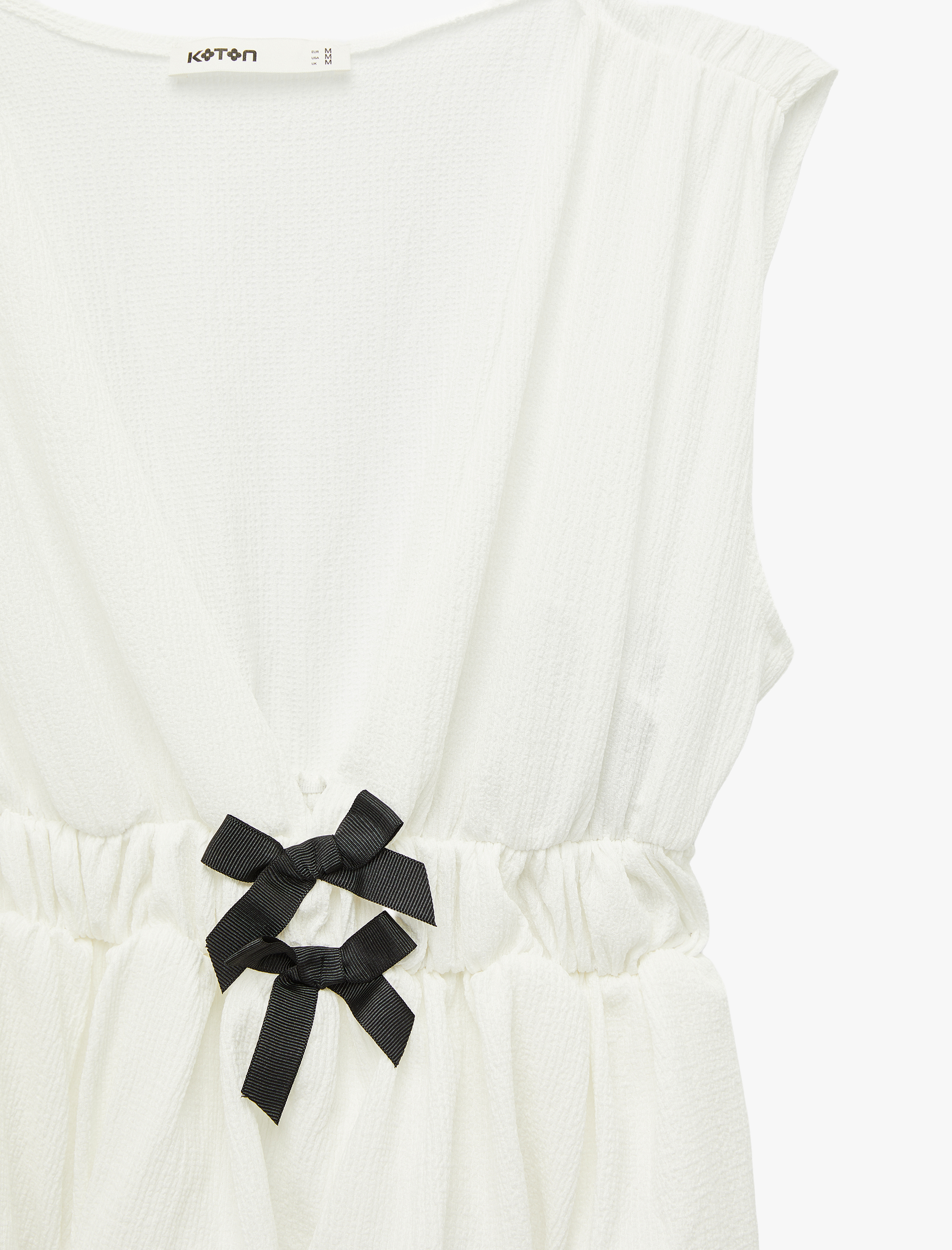   Slim Fit Beli Lastikli Yuvarlak Yaka Fiyonklu Kolsuz Bluz