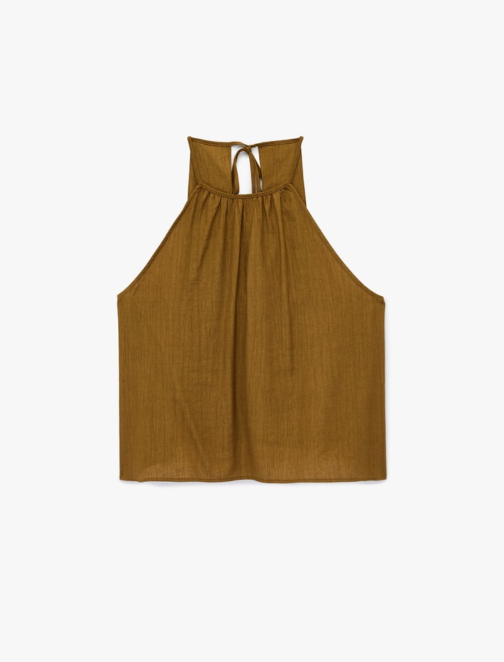  Viskon Karışımlı Kolsuz Bağlama Detaylı Dokulu Halter Yaka Bluz