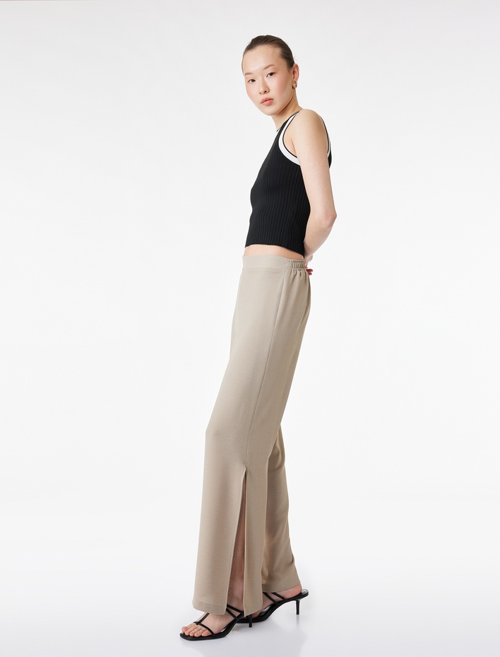  Beli Lastikli Yanları Yırtmaç Detaylı Düz Geniş Paça Pantolon