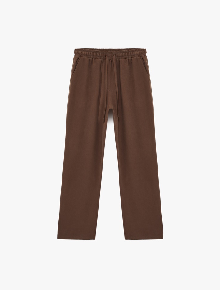  Kupro Viskon Kumaş Beli Lastikli Bağlamalı Cepli Düz Bol Paça Pantolon