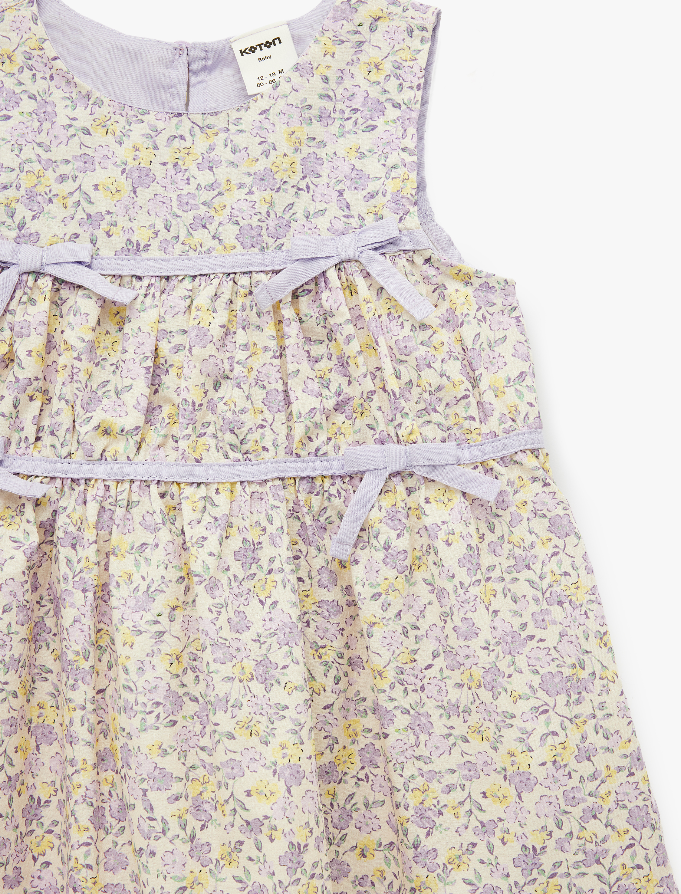  Kız Bebek Pamuklu Bisiklet Yaka Kolsuz Fiyonk Detaylı Çiçekli Elbise