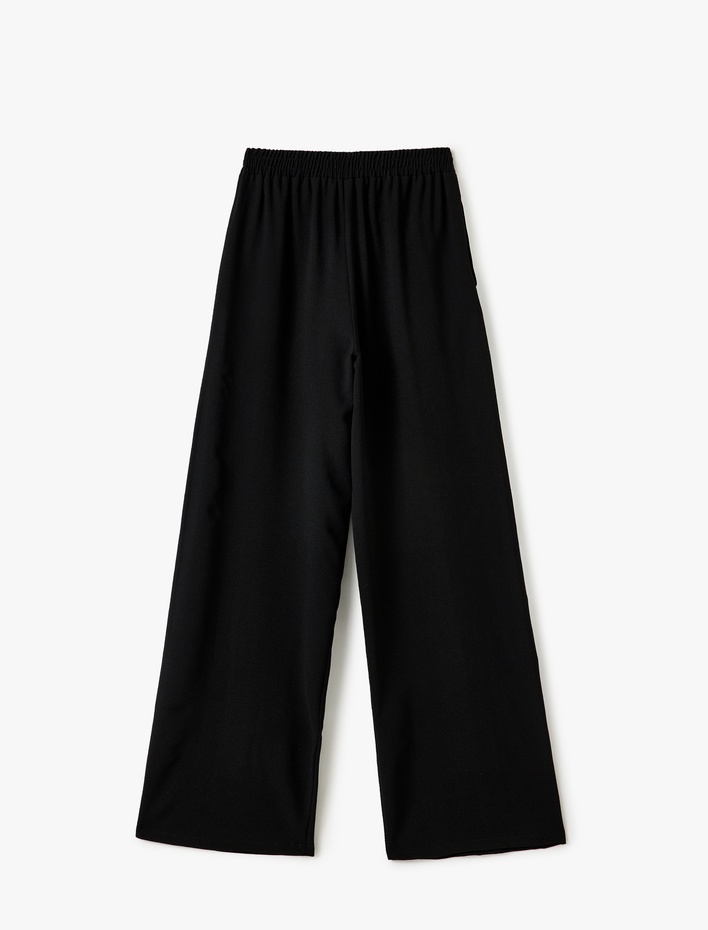  Geniş Paça Cepli Beli Bağcıklı Şerit Detaylı Pantolon