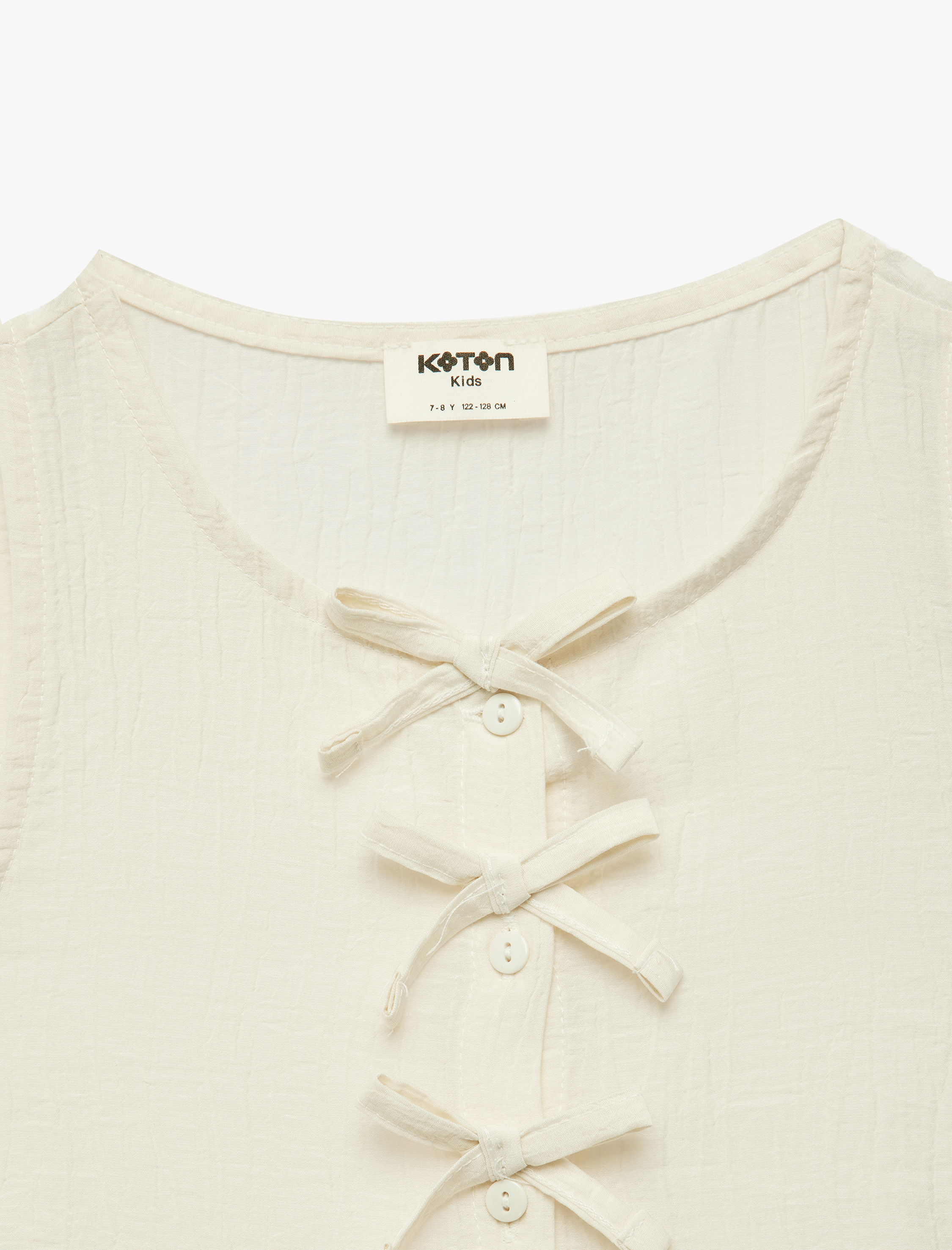  Kız Çocuk Bisiklet Yaka Bol Kalıp Düğmeli Fırfırlı Fiyonklu Viskon Kolsuz Bluz