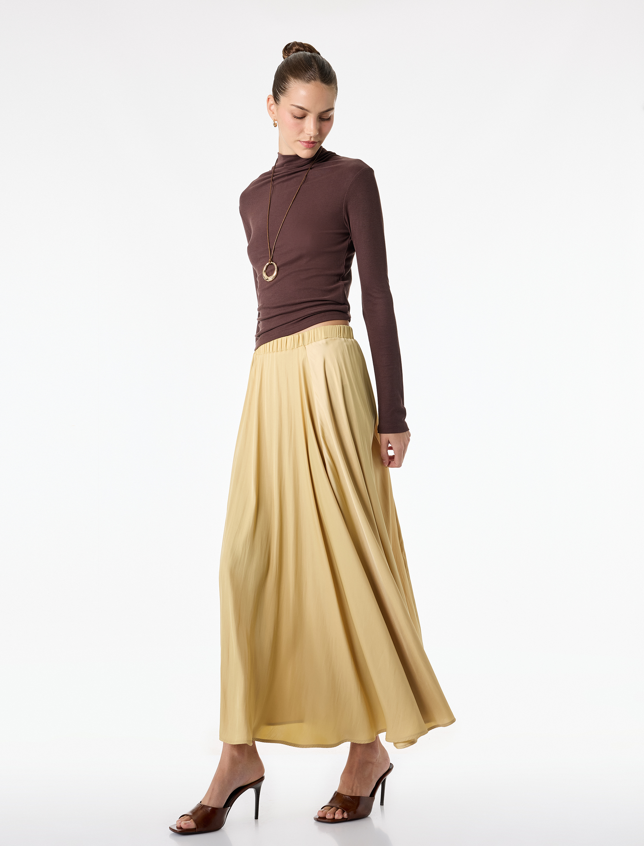   Beli Lastikli Pileli Uzun Saten Kloş Etek