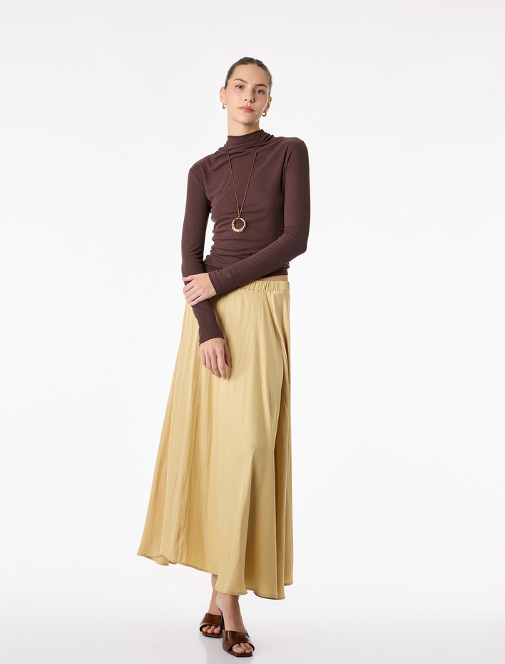  Beli Lastikli Pileli Uzun Saten Kloş Etek