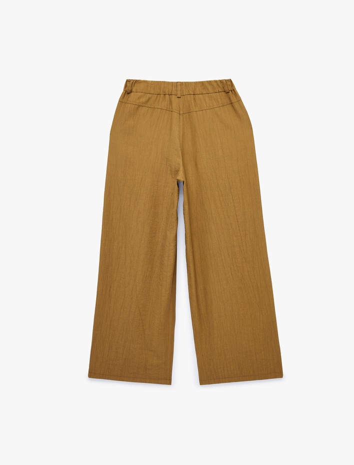  Viskon Gofre Kumaş Cepli Pile Detaylı Geniş Paça Palazzo Pantolon