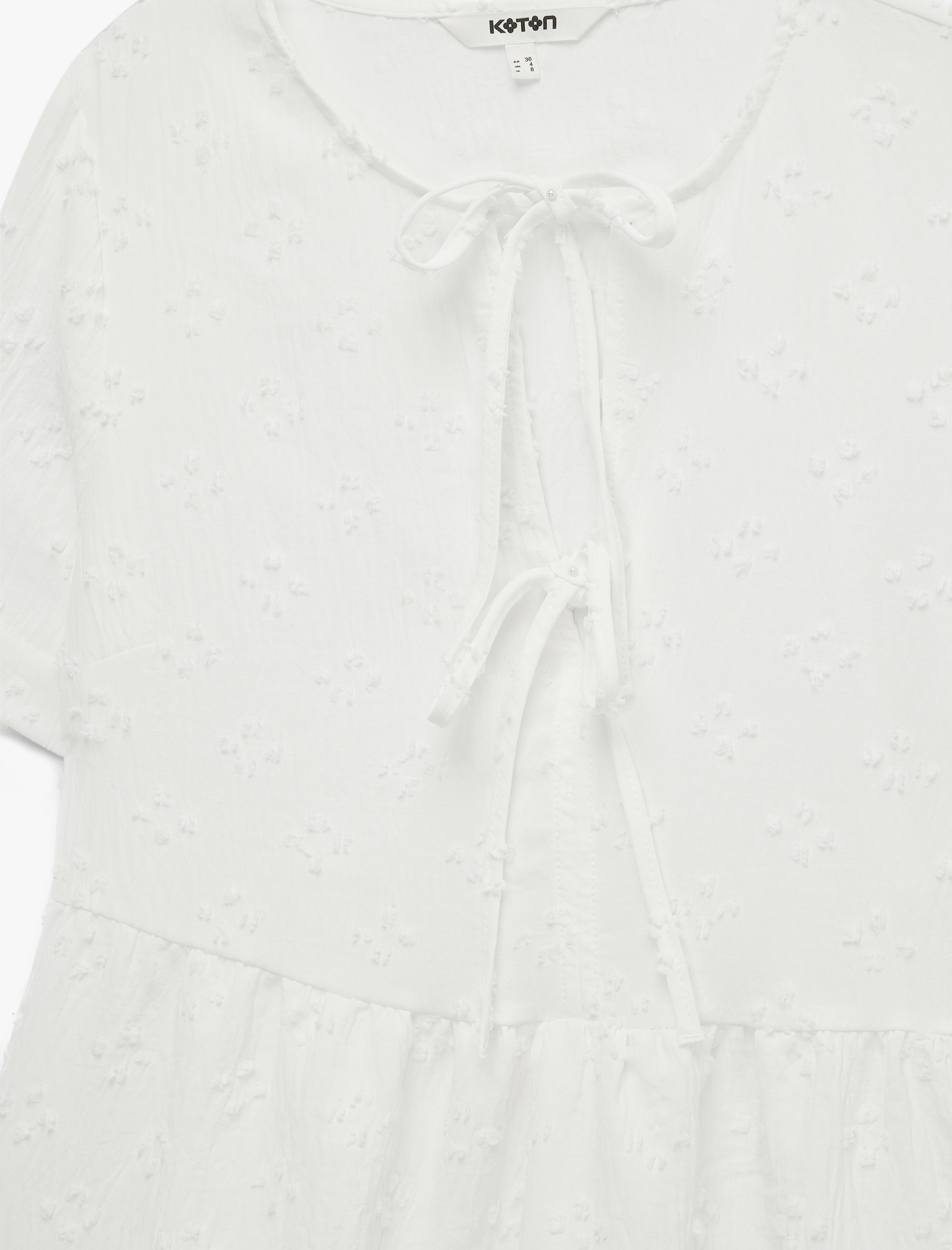   Bağlamalı Fiyonk Detaylı Kısa Kollu Dokulu Peplum Bluz