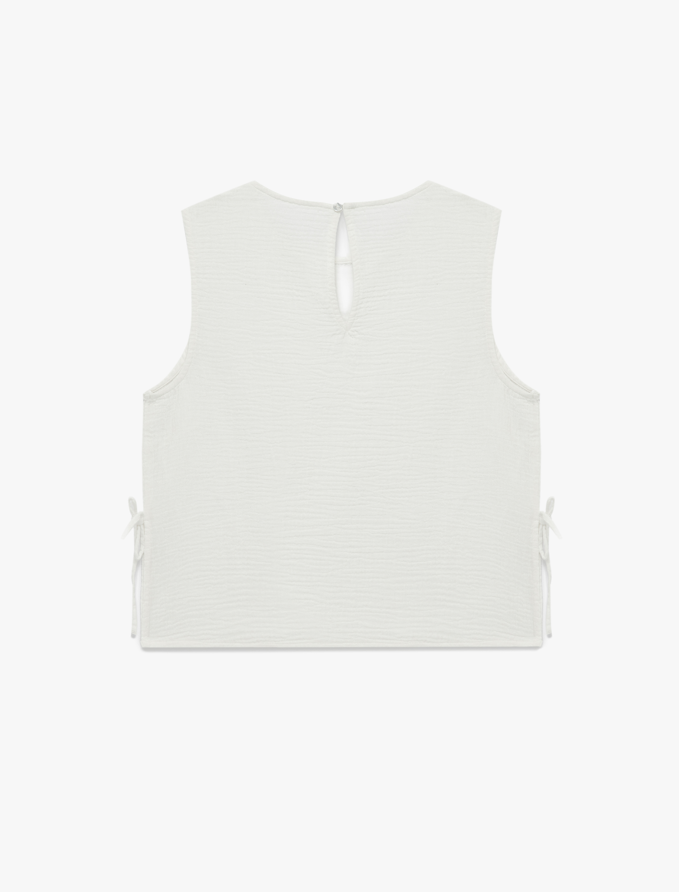   Pamuklu Yuvarlak Yaka Yanları Bağlamalı Fiyonklu Kolsuz Müslin Bluz