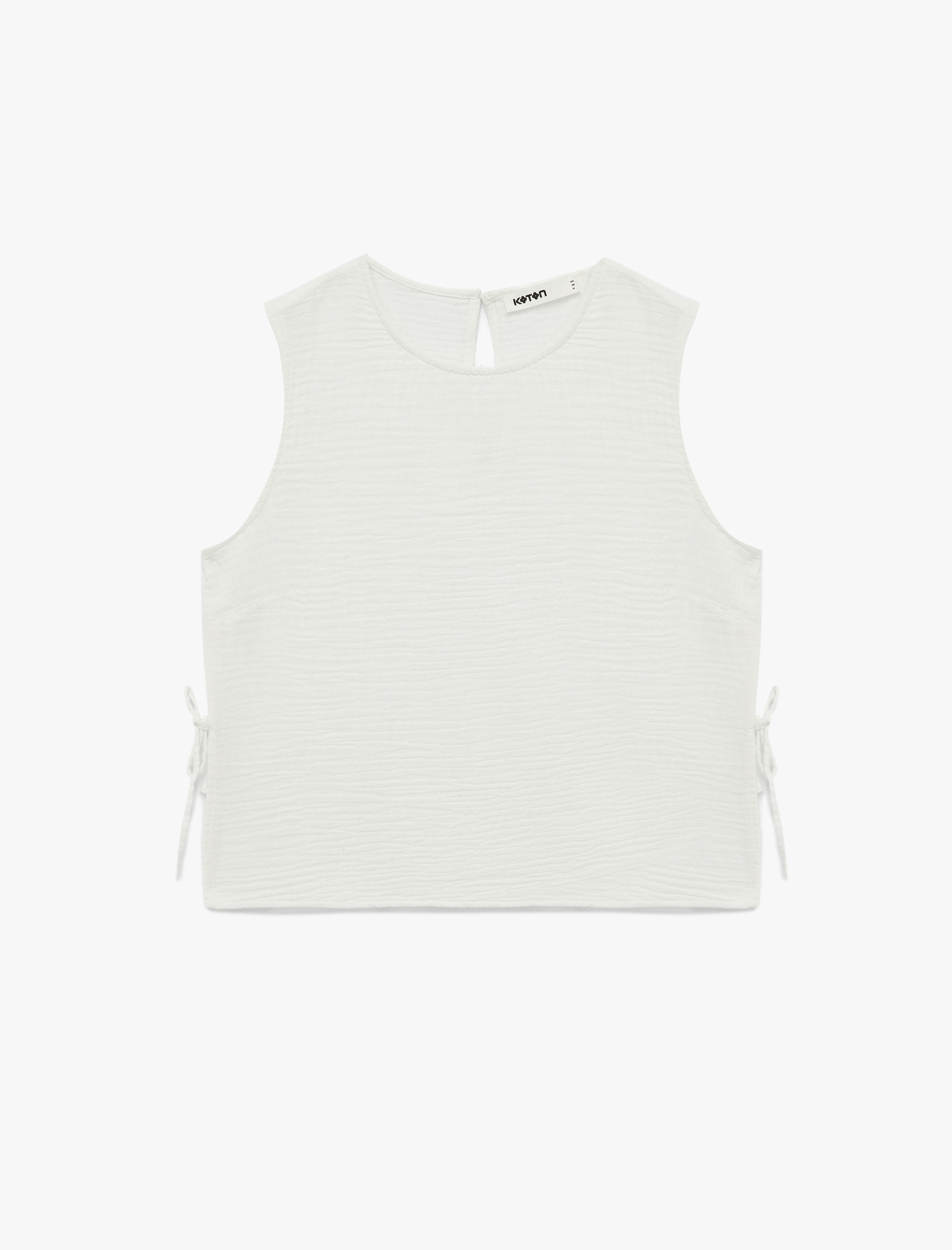   Pamuklu Yuvarlak Yaka Yanları Bağlamalı Fiyonklu Kolsuz Müslin Bluz