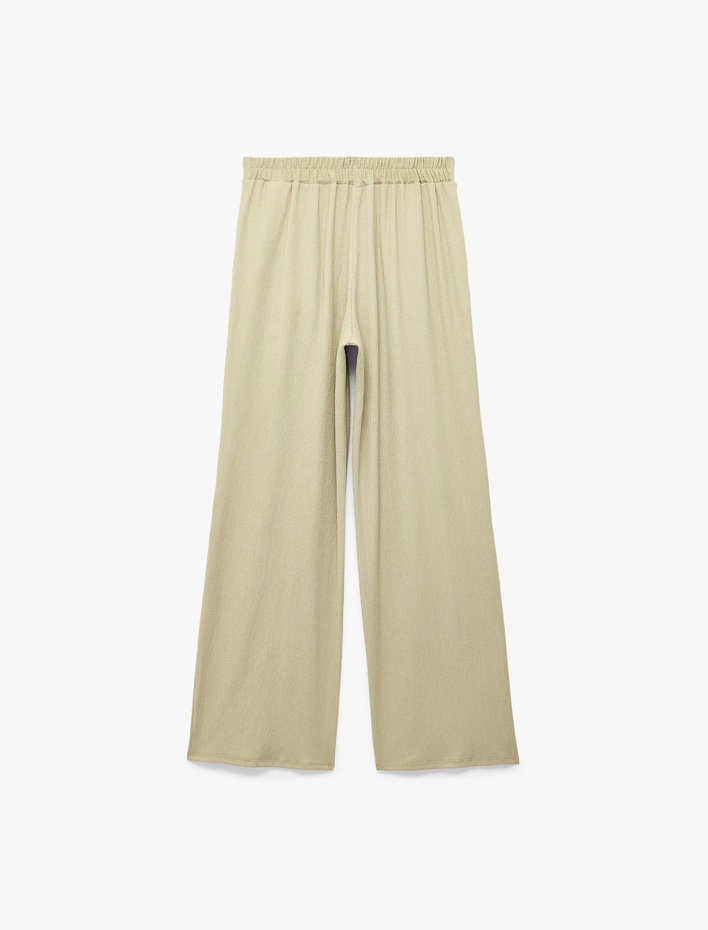  Bürümcük Kumaş Dokulu Cepli Pile Detaylı Geniş Paça Palazzo Pantolon