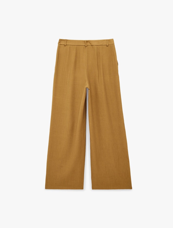  Viskon Dokulu Kumaş Cepli Pile Detaylı Geniş Paça Palazzo Pantolon