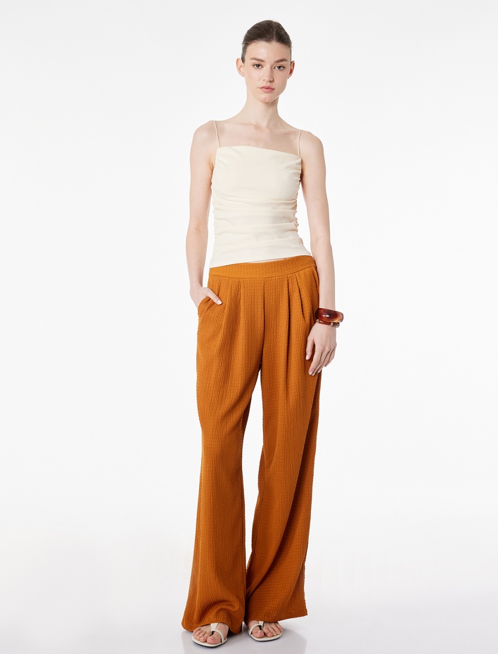  Bürümcük Dokulu Kumaş Pile Detaylı Cepli Geniş Paça Pantolon