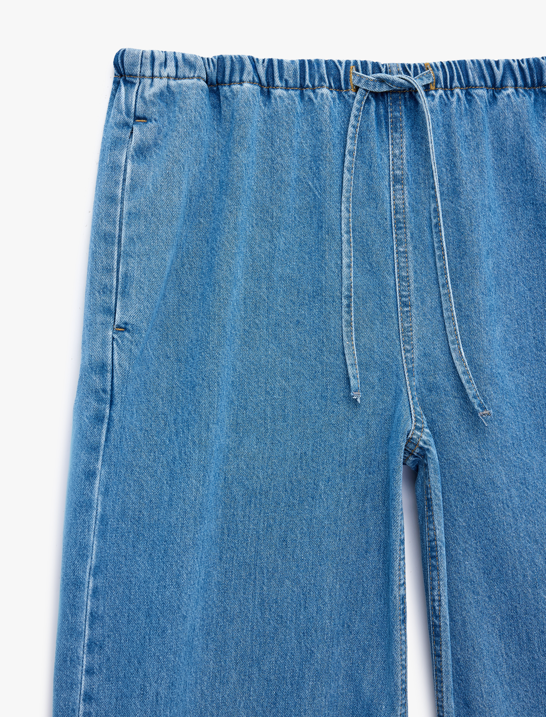   Beli Bağcıklı Cep Detaylı Bol Paça Denim Pantolon