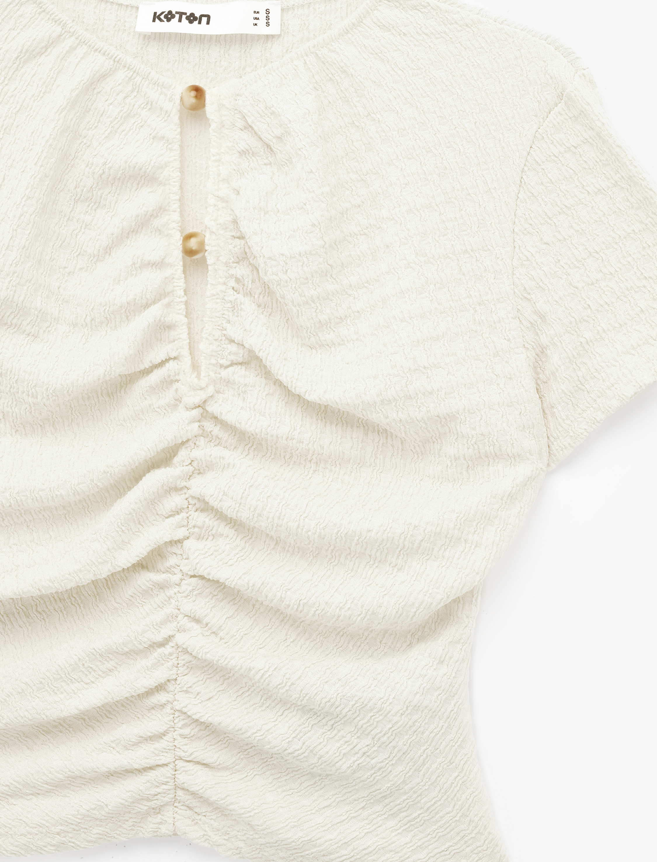   Bürümcük Kumaş Dokulu Slim Fit Kısa Kollu Pencere Detaylı Drapeli Bluz