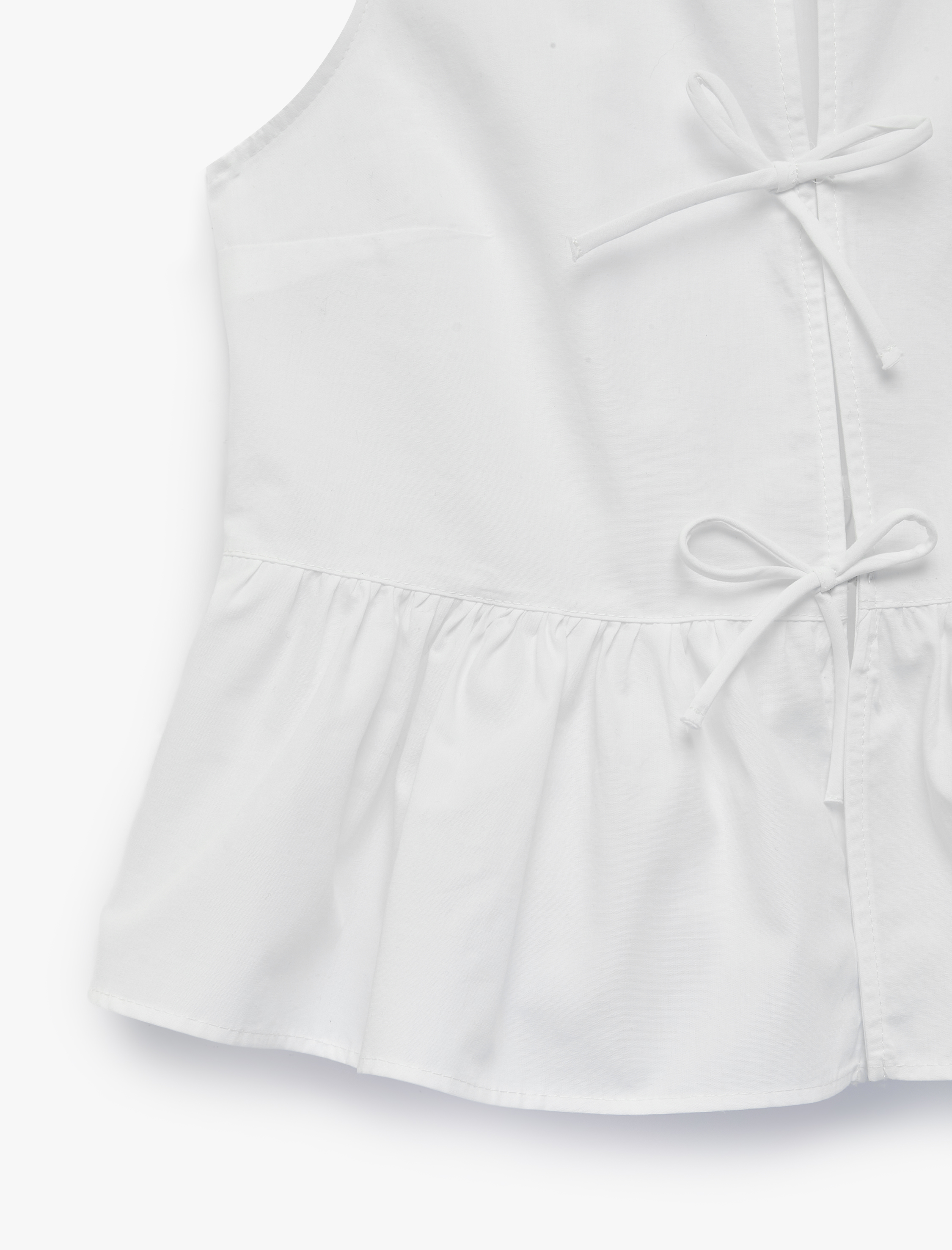   Pamuklu Kolsuz Yuvarlak Yaka Peplum Kesim Fiyonklu Poplin Bluz
