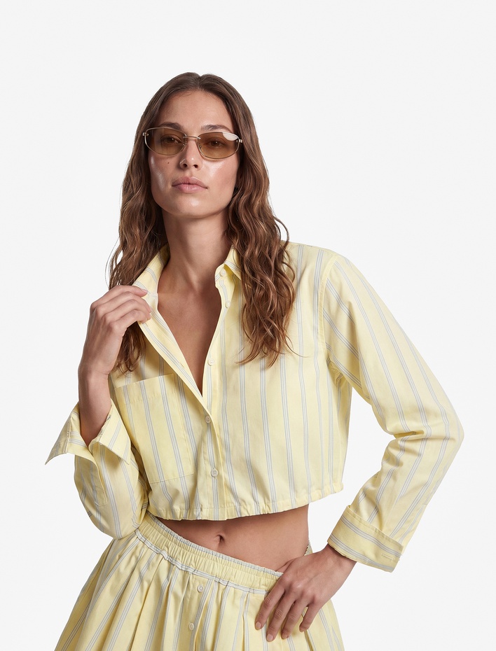 Koton X Sibil Çetinkaya - Pamuklu Uzun Kollu Cepli Bağlamalı Çizgili Crop Gömlek