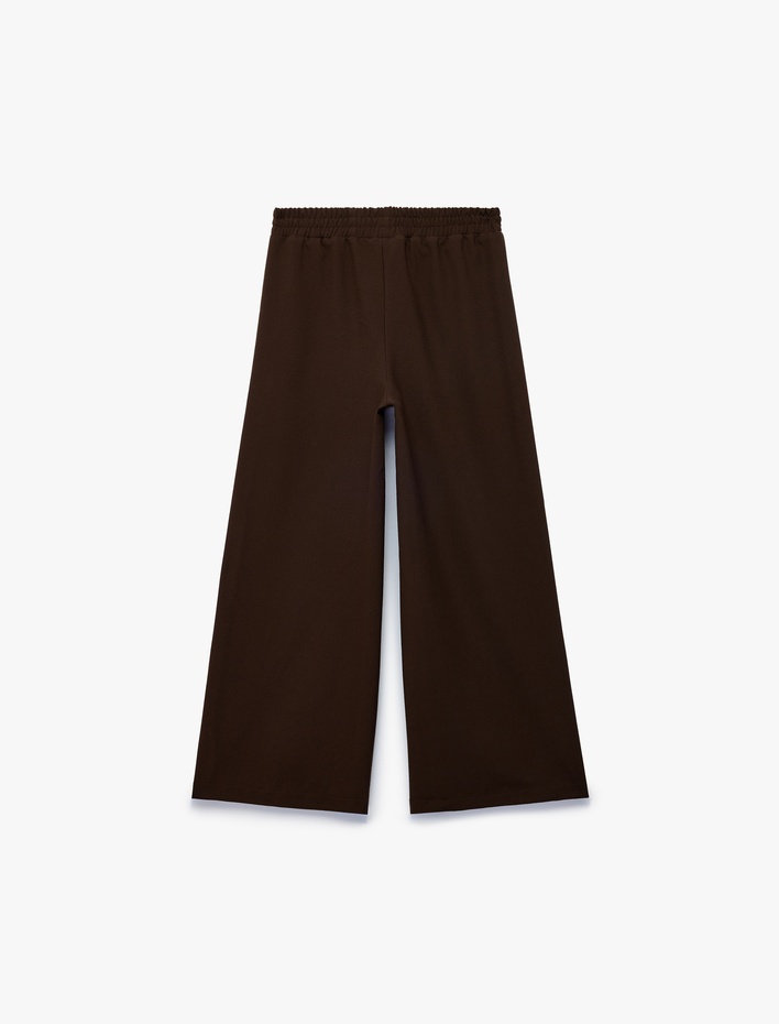 Kız Çocuk Beli Bağcıklı Biyeli Geniş Paça Pantolon