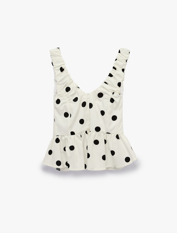  Koton X Sibil Çetinkaya - V Yaka Kolsuz Fırfırlı Peplum Kesim Puantiyeli Poplin Bluz