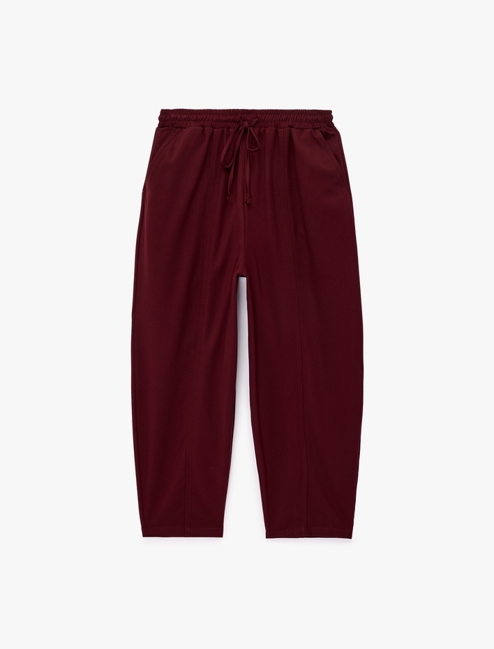 Beli Bağcıklı Cepli Bol Kesim Balon Pantolon