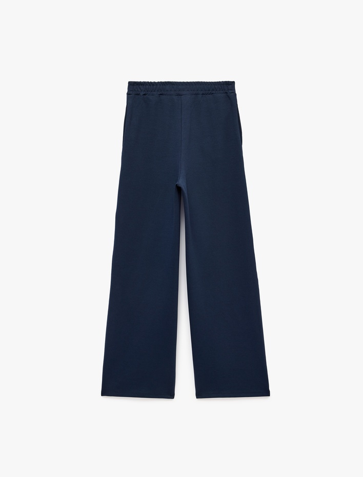  Normal Bel Regular Fit Cepli Düz Geniş Paça Pantolon